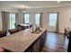 Kitchen island with breakfast bar, granite countertop, and dining area views at 112 Wilbur Lake Dr, Fuquay Varina, NC 27526