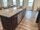 Kitchen island with breakfast bar, granite countertop, stainless steel dishwasher at 112 Wilbur Lake Dr, Fuquay Varina, NC 27526