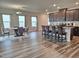 Open concept living area with hardwood floors, kitchen island, and dining area at 112 Wilbur Lake Dr, Fuquay Varina, NC 27526