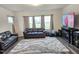 Cozy living room with plush sofas, large windows, and modern decor at 112 Wilbur Lake Dr, Fuquay Varina, NC 27526