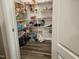 Walk-in pantry with wire shelving and hardwood floors at 112 Wilbur Lake Dr, Fuquay Varina, NC 27526