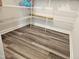 Wood-look flooring and wire shelving maximize storage space in this pantry at 112 Wilbur Lake Dr, Fuquay Varina, NC 27526
