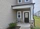 Inviting front porch featuring stone accents and a stylish entrance door at 112 Wilbur Lake Dr, Fuquay Varina, NC 27526