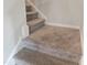 Carpeted staircase with neutral-colored carpet leads to the upper level at 112 Wilbur Lake Dr, Fuquay Varina, NC 27526