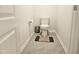 Bathroom featuring a standard toilet next to grey tiling at 112 Wilbur Lake Dr, Fuquay Varina, NC 27526