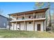 Two-story home with decks, covered patio and an outdoor grill in the backyard at 1128 E Geer St, Durham, NC 27704