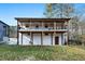 Two-story home with decks, covered patio, and back yard on a sunny day at 1128 E Geer St, Durham, NC 27704