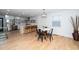 Open concept kitchen and dining area with stainless steel appliances and island seating at 1128 E Geer St, Durham, NC 27704