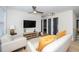 Stylish living room with a modern sofa, accent pillows, and a flat-screen TV at 1128 E Geer St, Durham, NC 27704