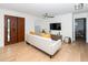 Bright and open living room with a comfortable sofa, modern ceiling fan, and light hardwood floors at 1128 E Geer St, Durham, NC 27704