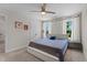 This cozy bedroom features large windows, neutral colors, and a ceiling fan at 12658 W Hanes Ave, Middlesex, NC 27557