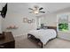 This bedroom offers natural light, a ceiling fan and closet space at 12658 W Hanes Ave, Middlesex, NC 27557
