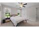 Comfortable bedroom with natural light, ceiling fan and double closet at 12658 W Hanes Ave, Middlesex, NC 27557