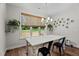 Dining area featuring natural light, chandelier, and views of the outdoor backyard at 12658 W Hanes Ave, Middlesex, NC 27557
