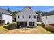 Back exterior of home with a screened-in porch and lounge chairs on a patio at 12658 W Hanes Ave, Middlesex, NC 27557