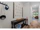 Hallway with console table and decorations, leading to living areas at 12658 W Hanes Ave, Middlesex, NC 27557