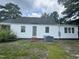 Backyard view featuring a well-maintained lawn and the back of the house at 1336 Hill Street St, Rocky Mount, NC 27801