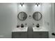 Bathroom with double sinks, framed circular mirrors, and matte black hardware at 1336 Hill Street St, Rocky Mount, NC 27801
