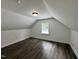 An upstairs bedroom with wood-look flooring and a window with a view at 1336 Hill Street St, Rocky Mount, NC 27801
