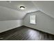 An upstairs bedroom with wood-look flooring and a window with a view at 1336 Hill Street St, Rocky Mount, NC 27801