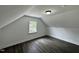 An upstairs bedroom with wood-look flooring and a window with a view at 1336 Hill Street St, Rocky Mount, NC 27801