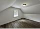 An upstairs bedroom with wood-look flooring and a window with a view at 1336 Hill Street St, Rocky Mount, NC 27801