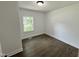 Bedroom with hardwood floors and a large window offering plenty of natural light at 1336 Hill Street St, Rocky Mount, NC 27801