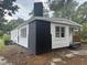 Angle view shows white siding with brick and a covered side porch at 1336 Hill Street St, Rocky Mount, NC 27801