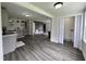 Open-concept living room with grey walls and hardwood floors, seamlessly connecting kitchen and adjacent spaces at 1336 Hill Street St, Rocky Mount, NC 27801