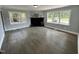 Spacious living room featuring wood paneling, a fireplace and large windows that provide great natural light at 1336 Hill Street St, Rocky Mount, NC 27801