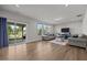 Bright living room offering hardwood floors, comfortable seating, a sliding glass door, and lots of natural light at 14 Shady Oaks Rd, Angier, NC 27501