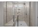 Tiled walk-in shower with bench, glass enclosure, and niche at 14 Shady Oaks Rd, Angier, NC 27501