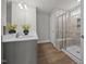 Spacious main bath boasts double vanity and tiled walk-in shower with a bench at 14 Shady Oaks Rd, Angier, NC 27501