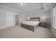 Main bedroom features neutral decor, carpet, tray ceiling, and ample natural light at 14 Shady Oaks Rd, Angier, NC 27501