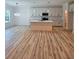 Open kitchen featuring an island, modern appliances, and hard wood floors at 1414 Sagamore Dr, Louisburg, NC 27549