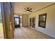Rear screened porch with ceiling fan and wood flooring at 1414 Sagamore Dr, Louisburg, NC 27549