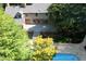Aerial view showing a patio leading to a lovely pool on a beautiful tree-lined property at 14236 Wyndfield Cir, Raleigh, NC 27615