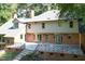 Expansive backyard featuring a large patio and outdoor living space at 14236 Wyndfield Cir, Raleigh, NC 27615