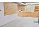 Spacious basement features pegboard walls, built in wooden cabinets, and plenty of workspace at 14236 Wyndfield Cir, Raleigh, NC 27615