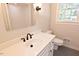 Bright bathroom with white vanity and sink at 14236 Wyndfield Cir, Raleigh, NC 27615