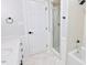 Bright bathroom featuring a shower/tub combination with white tile and neutral color scheme at 14236 Wyndfield Cir, Raleigh, NC 27615