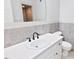 Bright bathroom featuring sink, and a view to a shower at 14236 Wyndfield Cir, Raleigh, NC 27615