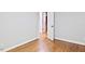 Bedroom with hardwood floors, neutral paint, white doors and trim with natural light at 14236 Wyndfield Cir, Raleigh, NC 27615