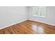 Bright bedroom with wood floors and a double window at 14236 Wyndfield Cir, Raleigh, NC 27615