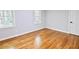 Bedroom featuring hardwood floors, gray walls, white trim, and natural light at 14236 Wyndfield Cir, Raleigh, NC 27615