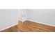 Bedroom with wood flooring, white trim, and doorway at 14236 Wyndfield Cir, Raleigh, NC 27615