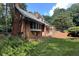 Beautiful brick home with well-manicured lawn, mature trees, and a bay window at 14236 Wyndfield Cir, Raleigh, NC 27615