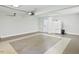 Finished garage with painted floors, attached refrigerator, and modern lighting system at 14236 Wyndfield Cir, Raleigh, NC 27615