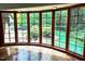 Living room with hardwood floors featuring a bay window with natural views at 14236 Wyndfield Cir, Raleigh, NC 27615