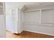 Bright walk-in closet with built-in shelving, and plenty of hanging storage at 14236 Wyndfield Cir, Raleigh, NC 27615